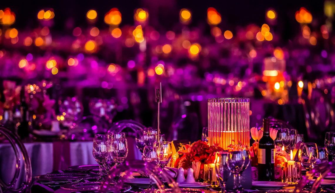 Pink and Purple Christmas Decor with candles and lamps for a large party or Gala Dinner
